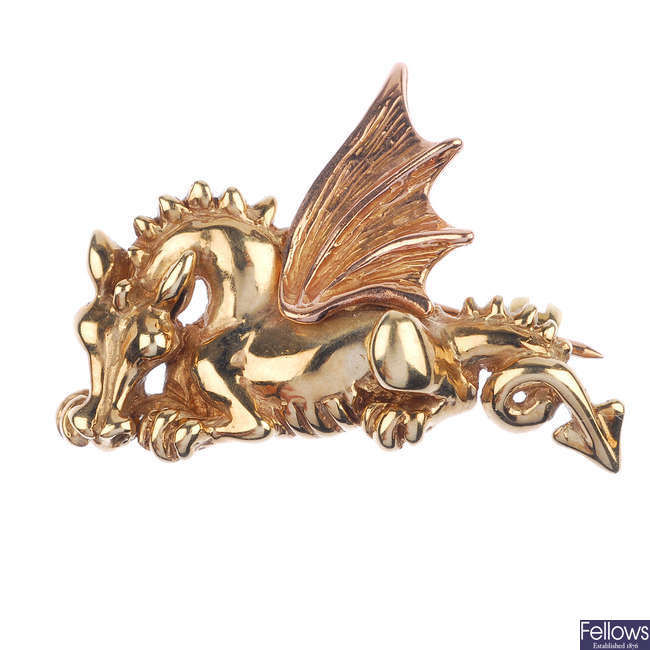 CLOGAU - a 9ct gold Welsh dragon brooch.