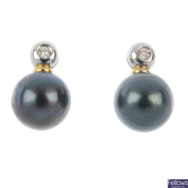 A pair of stained cultured pearl and diamond ear studs.