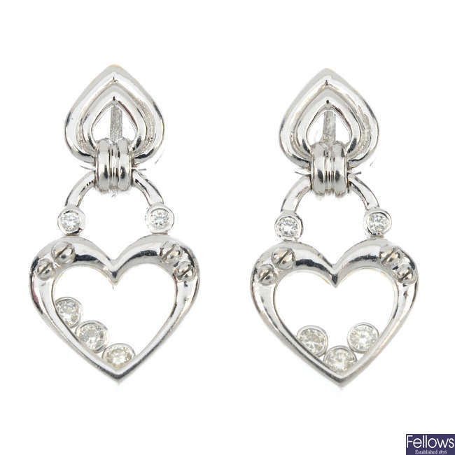 A pair of 18ct gold diamond heart ear pendants.