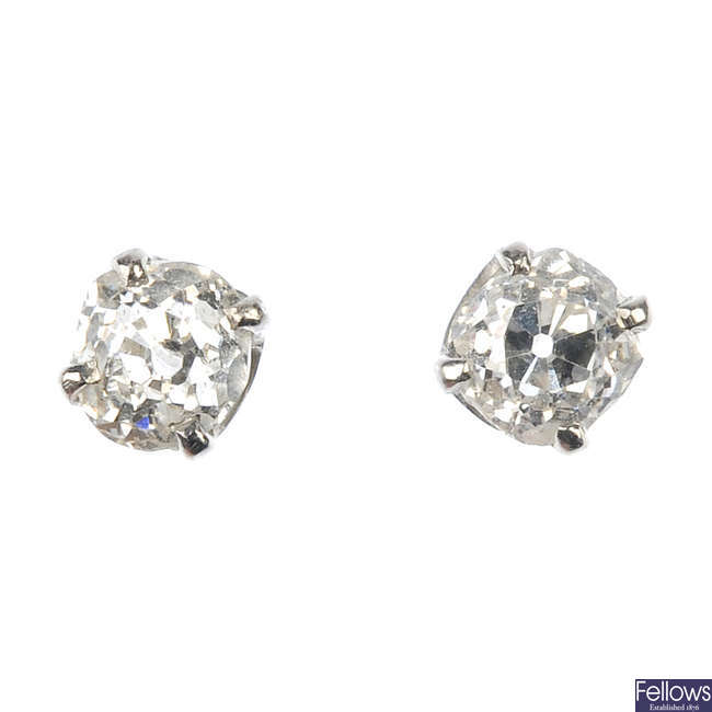 A pair of old-cut diamond single-stone ear studs.