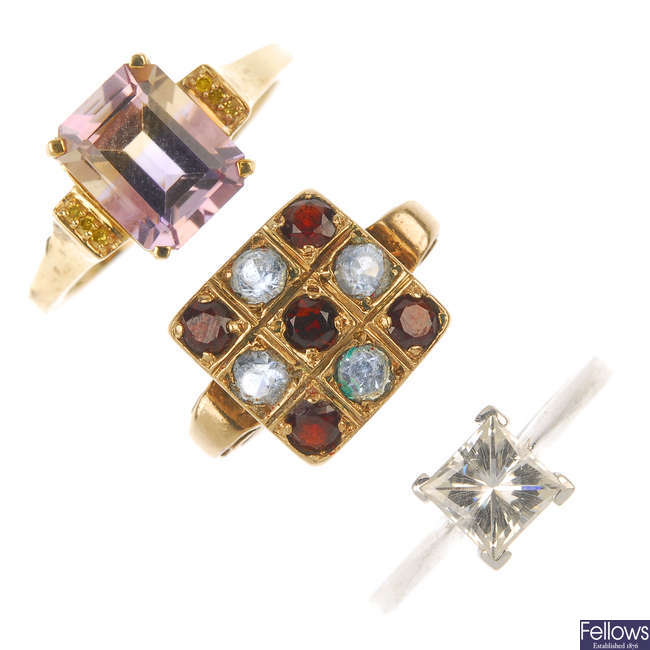 A selection of three 9ct gold gem-set rings.