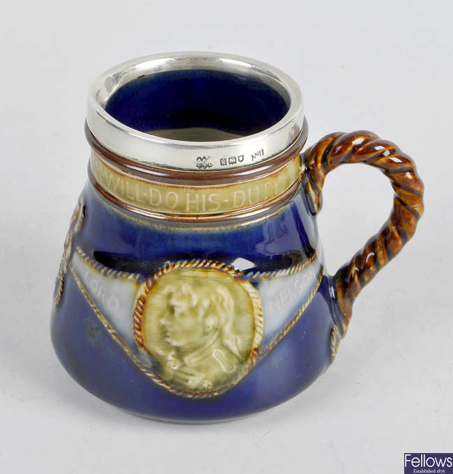 A Royal Doulton stoneware Lord Nelson jug with silver rim