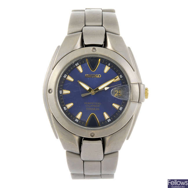 LOT:94 | SEIKO - a gentleman's Perpetual Calendar Titanium bracelet watch.
