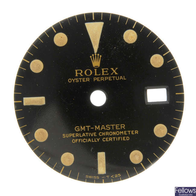 ROLEX - a gloss black Singer dial with gilt writing for a GMT-Master. 