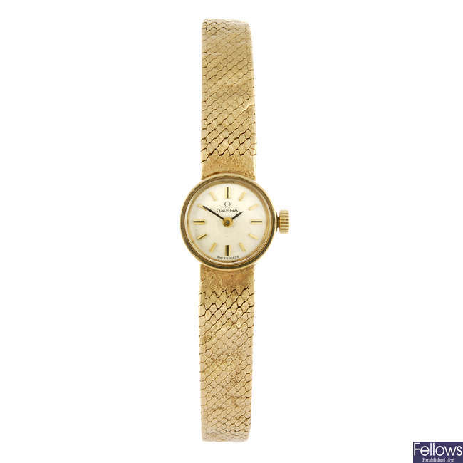 OMEGA - a lady's 9ct gold bracelet watch.