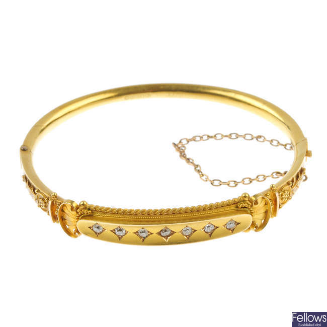 A late Victorian 15ct gold diamond hinged bangle.
