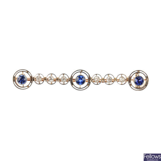 An early 20th century gold, sapphire and diamond bar brooch.
