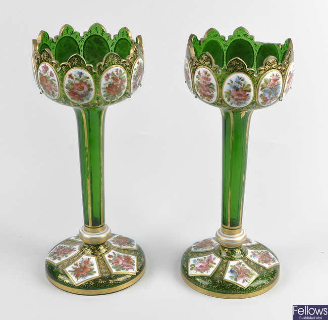 A pair of late 19th century Bohemian overlay green glass table lustres