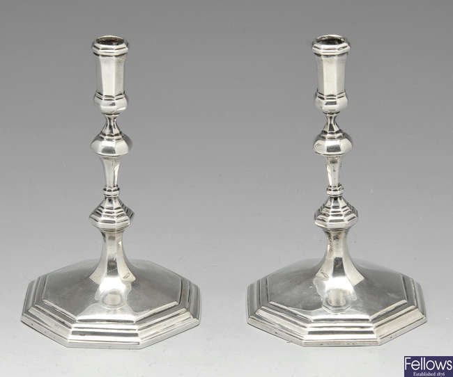 A late Victorian pair of silver tapersticks.