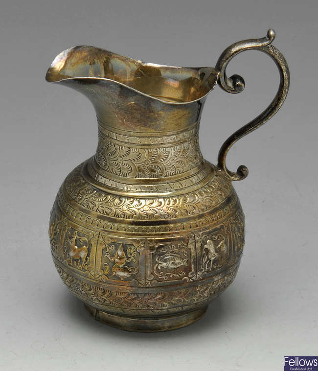  A Victorian silver zodiac cream jug and christening mug.
