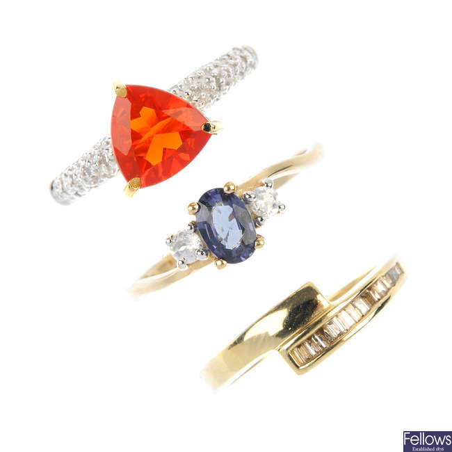 A selection of three 9ct gold diamond and gem-set rings.