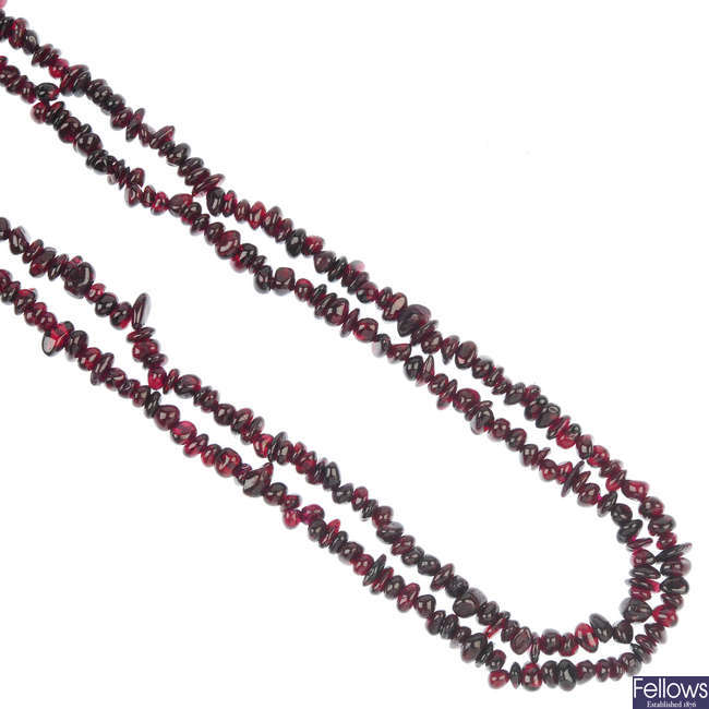 A selection of three garnet bead single-row necklaces.