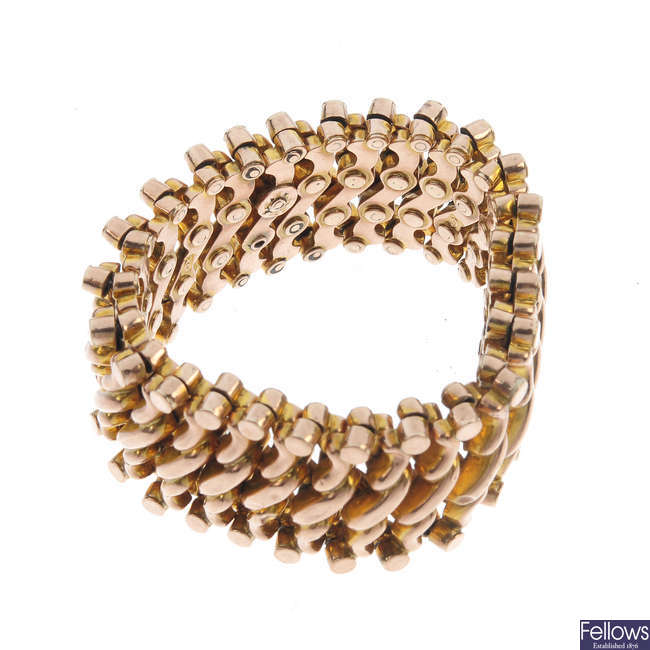 An early 20th century 9ct gold expandable bracelet and two brooches and two stickpins. 