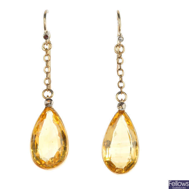 A pair of citrine and diamond ear pendants.