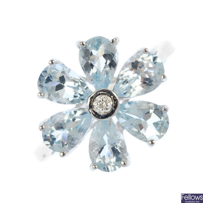 A 9ct gold aquamarine and diamond floral cluster ring.