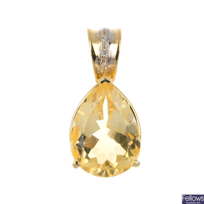 A citrine and diamond pendant.