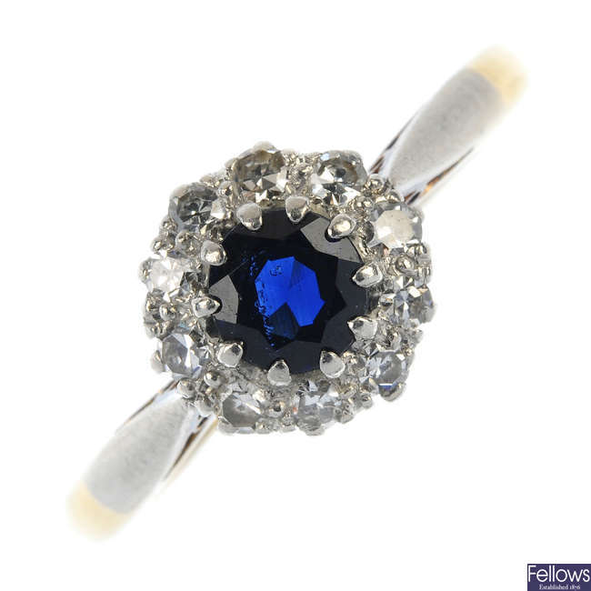 A mid 20th century 18ct gold and platinum sapphire and diamond cluster ring.