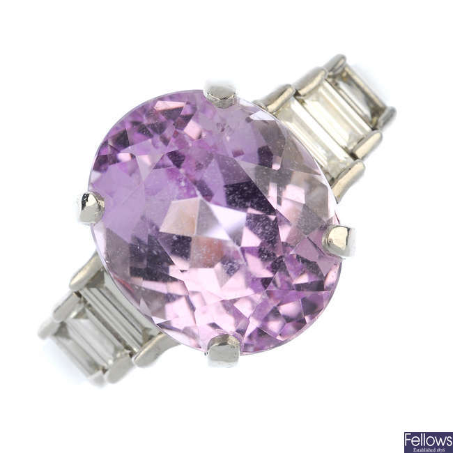 A kunzite and diamond dress ring.