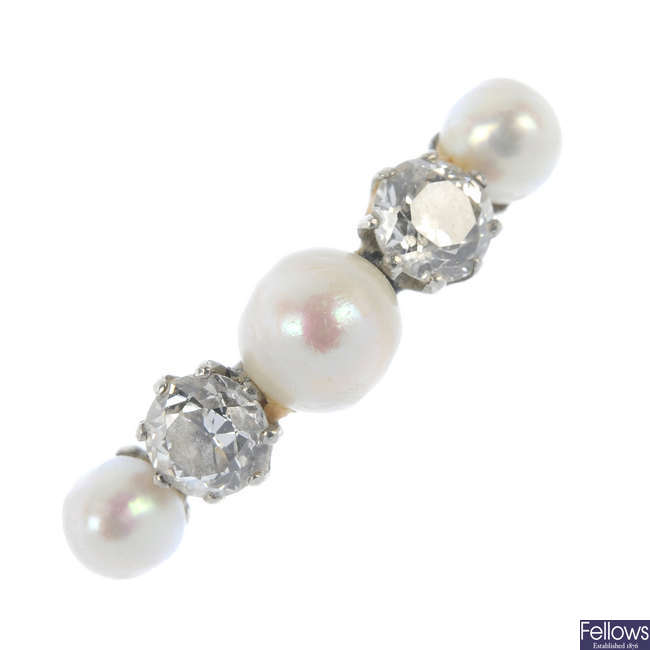 An early 20th century platinum diamond and cultured pearl five-stone ring.