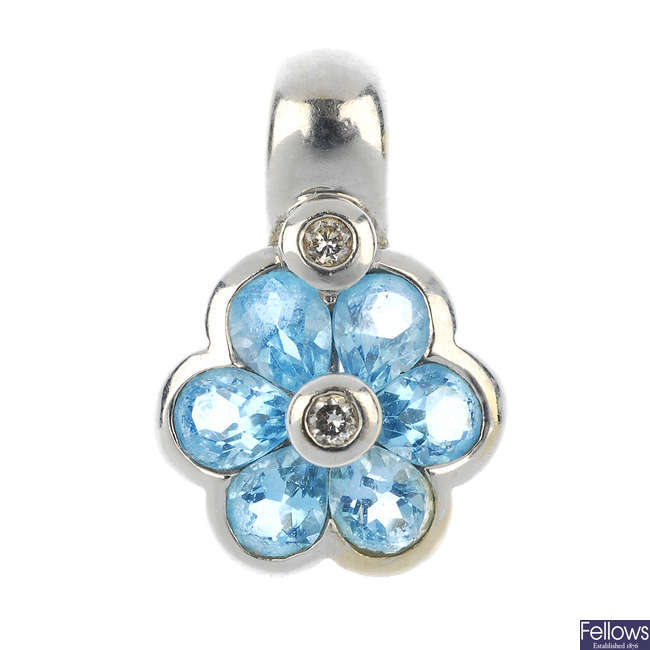 An 18ct gold diamond and topaz floral pendant.