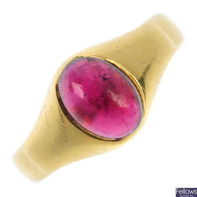 An early 20th century 18ct gold garnet single-stone ring.