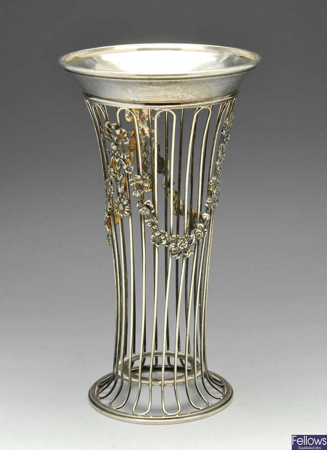 An early 20th century silver openwork vase, missing liner.