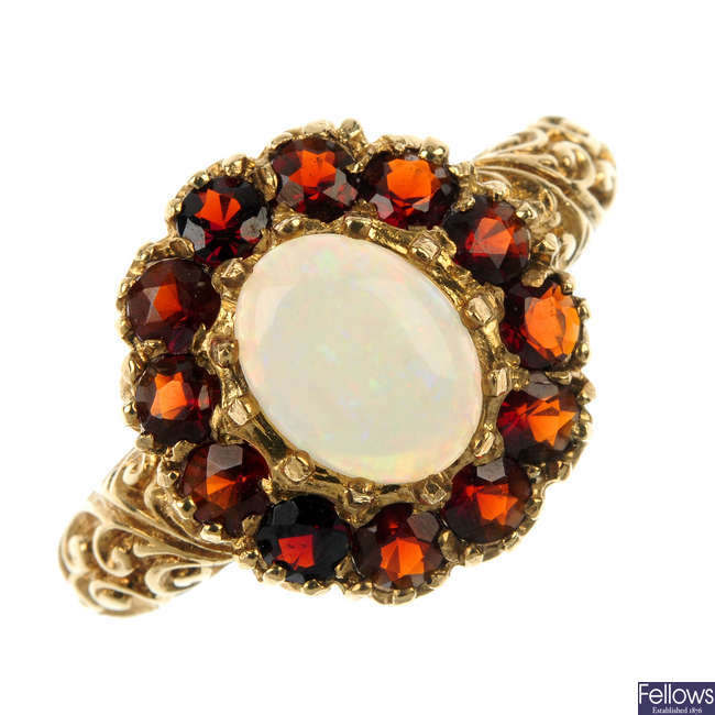 A 9ct gold opal and garnet dress ring.