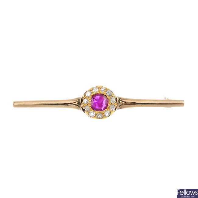 A mid 20th century gold ruby and diamond cluster bar brooch.