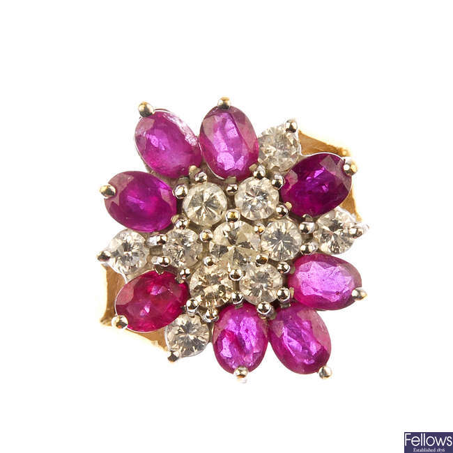 A 9ct gold ruby and diamond cluster ring. 