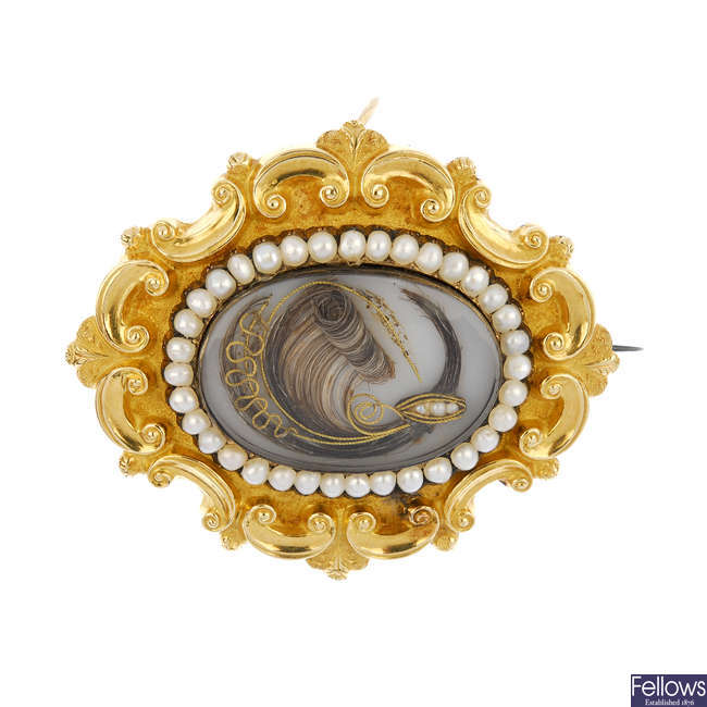 A mid Victorian gold split pearl memorial brooch.