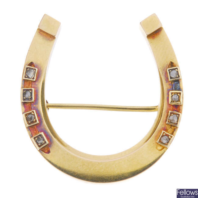 An early 20th century 14ct gold diamond horseshoe brooch.