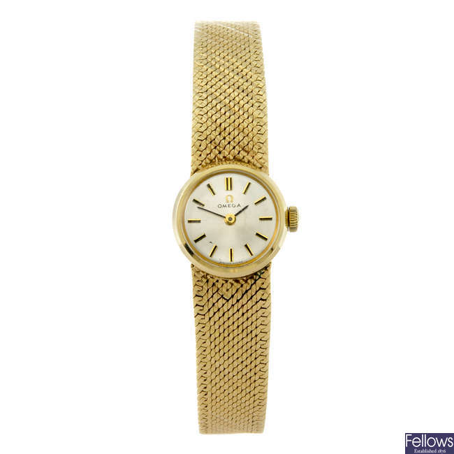 OMEGA - a lady's 9ct yellow gold bracelet watch.