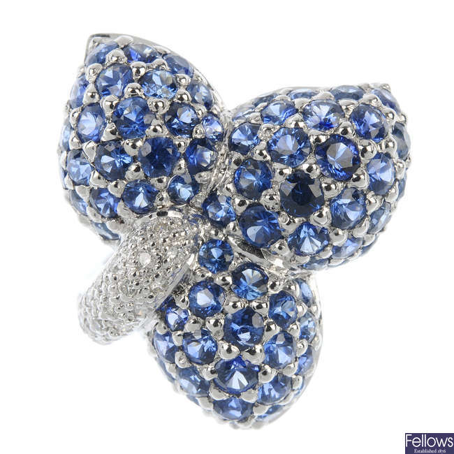 A sapphire and diamond floral dress ring.