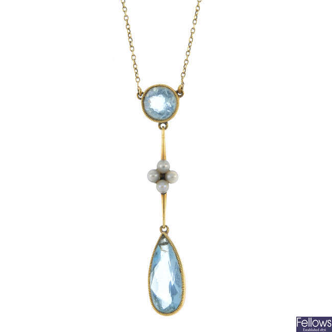 An early 20th century 15ct gold aquamarine and seed pearl pendant.