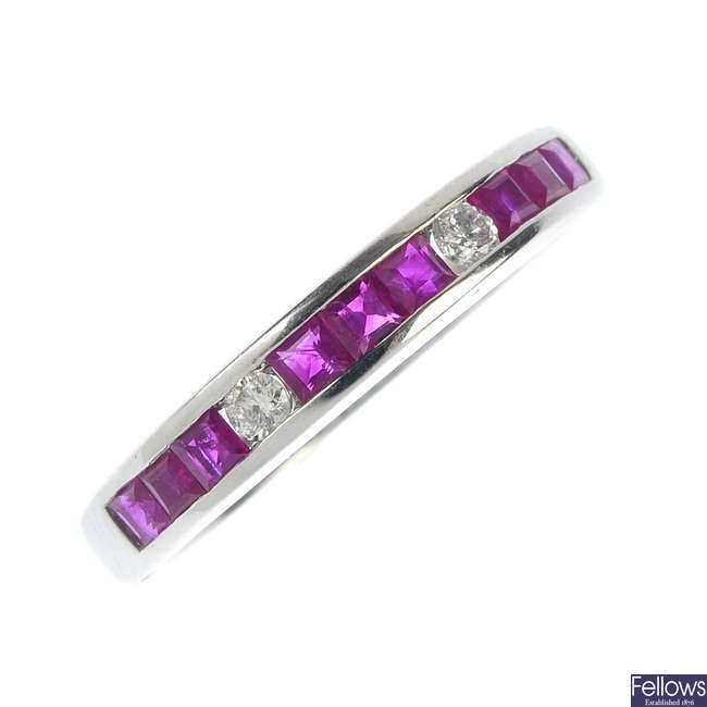 A 9ct gold ruby and diamond half-circle eternity ring.