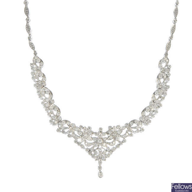 LOT:133 | A diamond garland necklace.