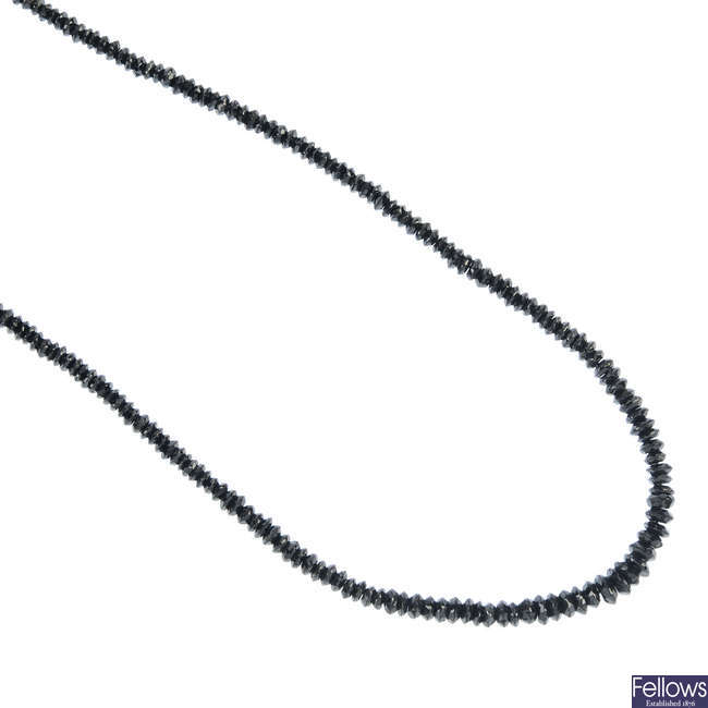 A graduated single-strand gem-set necklace. 