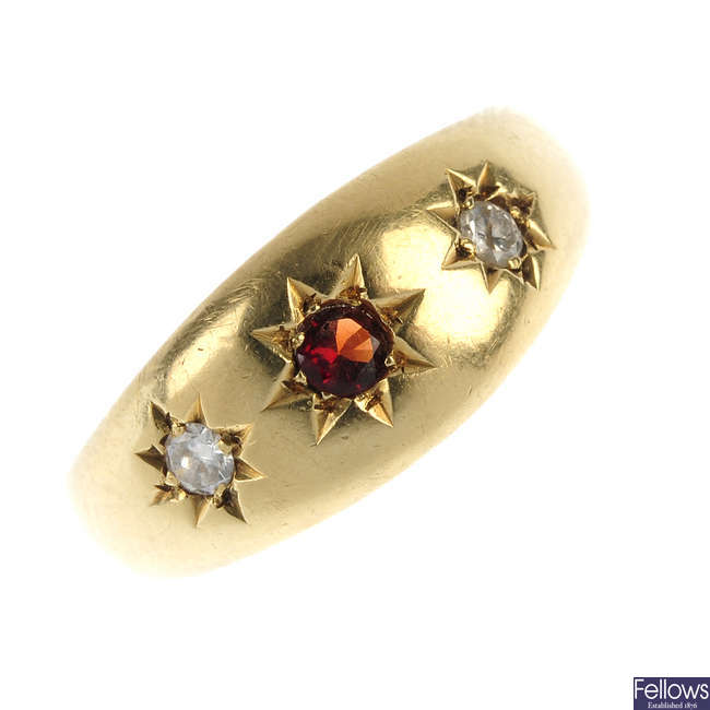 A mid 20th century 22ct gold diamond and garnet ring.