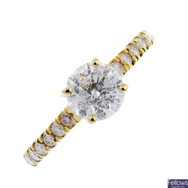 A 14ct gold fracture filled diamond single-stone ring.