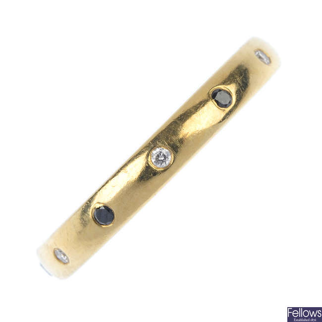 An 18ct gold diamond and gem-set band ring. 