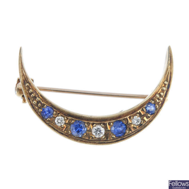 A 9ct gold sapphire and diamond crescent brooch.