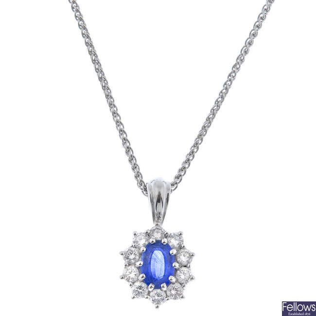 An 18ct gold sapphire and diamond cluster pendant and chain.