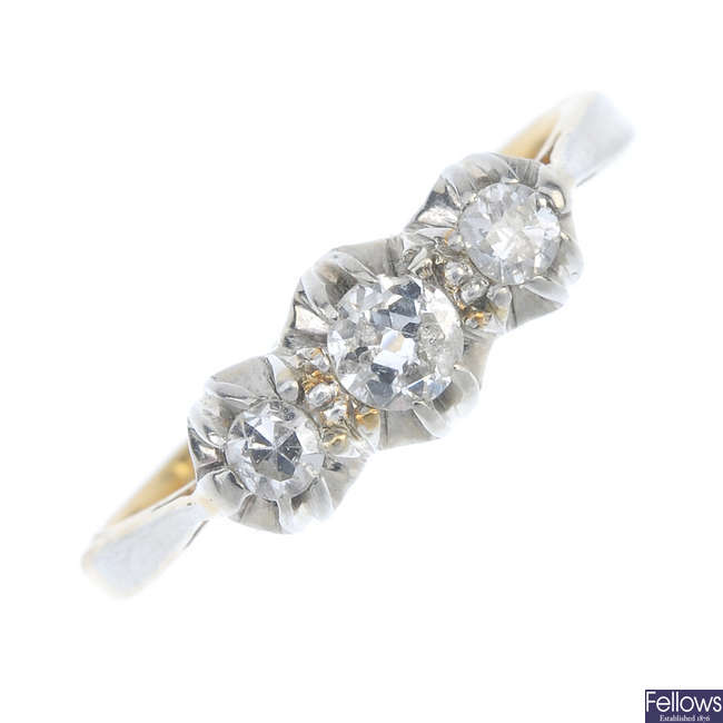 An early 20th century platinum and 18ct gold diamond three-stone ring.