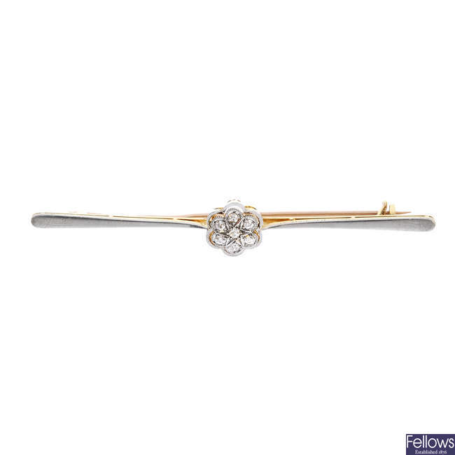 An early 20th century gold diamond cluster bar brooch.