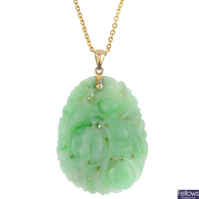 An early 20th century carved jade pendant.
