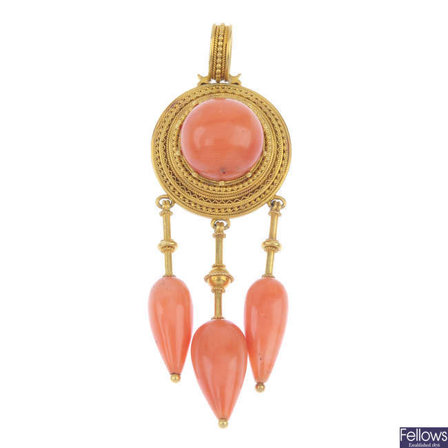 A mid 19th century gold coral pendant. 