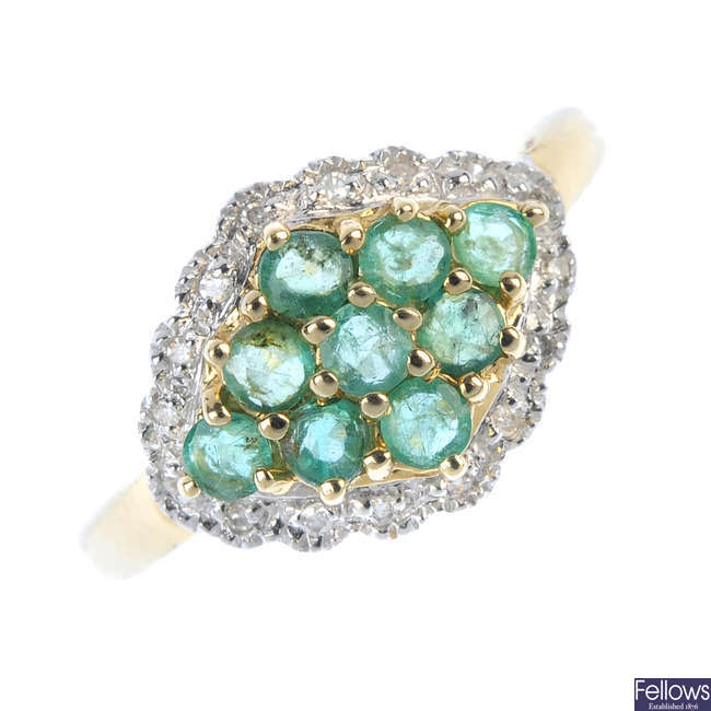 A 9ct gold emerald and diamond cluster ring. 