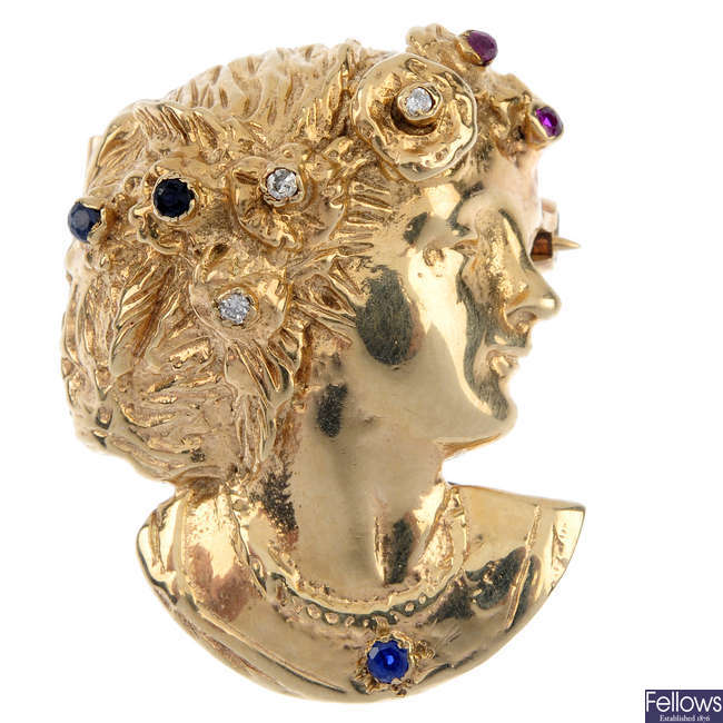 A 9ct gold diamond and gem-set figural brooch.
