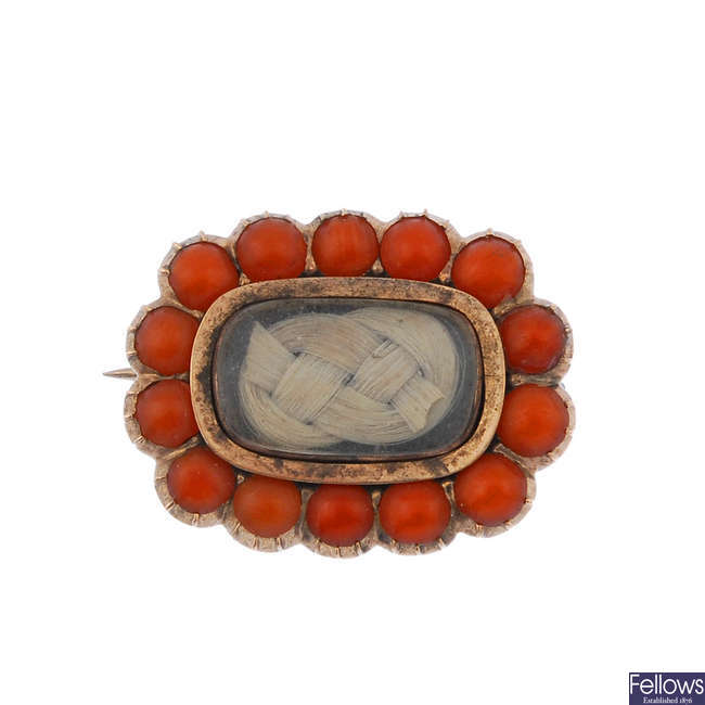 A mid Victorian coral and hair brooch.