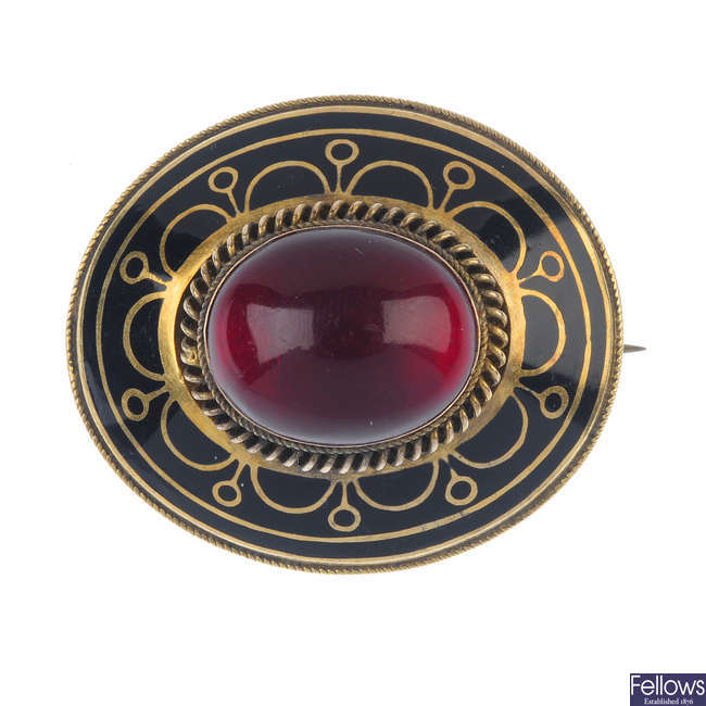 A late 19th century gold, red paste and enamel memorial brooch.